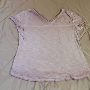 A light pink v neck short sleeve shirt